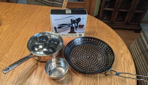 lot 384 image: Corkscrew Wine Bottle Opener, SALT Egg Poacher, Pizza Grill Pan, & Stainless Steel Bowl