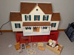 lot 573 image: Beautiful Dollhouse, (3) Red Storage bins, & Box wAccessories