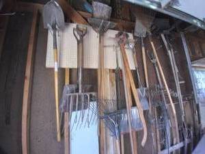 lot 76 image: Wall Full of Tools (Shovels, Pitchf...