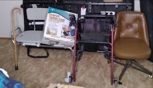 lot 284 image: Raised Toilet Seat In Box, Shower Seat With Extension, Vintage Dining Chair, Cane, & Medical Walker See Photos