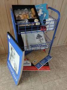 Sketch books, glitter, and cart