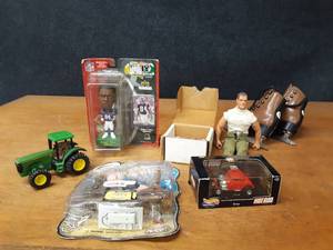 lot 165 image: Randy Moss Bobblehead, GI Joe, Size 10 Kids Ice Skates and More