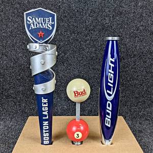 lot 184 image: Lot of 3 Beer Tap Handles - Sam Adams Boston Lager, Bud King of Beers Pool-themed Handle, and Bud Light