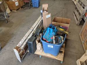 lot 299 image: Pallet lot of Miscellaneous - Size 13 Nike Shoes, Electric Car Racetrack, Automotive Emergency Kit, Large Roll of Plastic Sheeting, Windshield Wipers (24, 26, and 28), Misc. Tools, and More