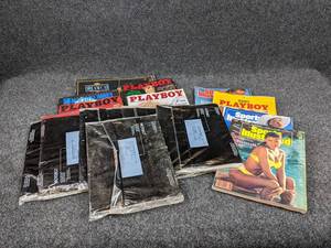 lot 306 image: Lot of Early 1990s Sports Illustrated Swimsuit Issues as well as Playboy Magazines
