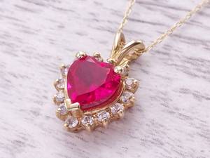 Heart Shaped Ruby Necklace With Diamond Halo in Yellow Gold