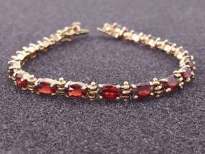 Charming Oval Cut Garnet Tennis Bracelet