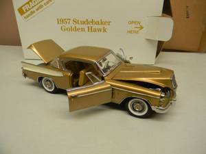 lot 27 image: THE DANBURY MINT 124 SCALE 1957 STUDEBAKER GOLDEN HAWK - IN BOX - GREAT PIECE - SEE PICTURES