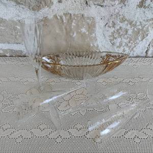 Four Champagne Flutes and Crystal Condiment Bowl