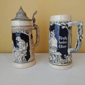 Two Blue and Cream German Steins