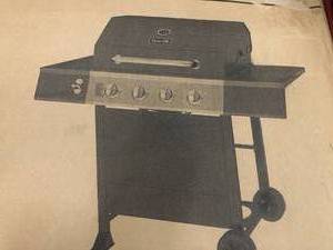 4-Burner Propane Gas Grill in Black by Dyna-Glo- slightly damaged - see pictures