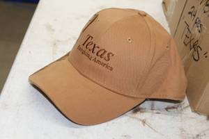 lot 266 image: Lot of ( 24 ) Baseball Caps Light Brown with logo Texas Energizing America