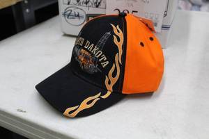 lot 285 image: Lot of ( 24 ) Baseball Caps BlackOrange with logo North Dakota