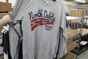 lot 902 image: Lot of ( 7 ) Shirts Small with logo North Dakota