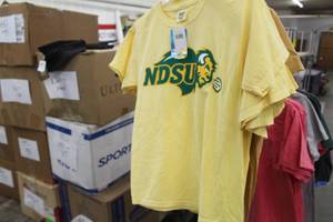 lot 948 image: Lot of ( 11 ) T-Shirts Small Yellow with logo NDSU