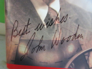 lot 108 image: COACH WOODEN SIGNED COPY OF ONE ON ONE BOOK
