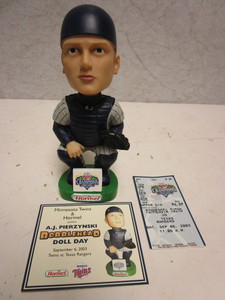 lot 125 image: A.J. PIERZYNSKI MINNESOTA TWINS CENTRAL DIVISION CHAMPIONS BOBBLEHEAD DOLL, W CARD, TICKET STUB