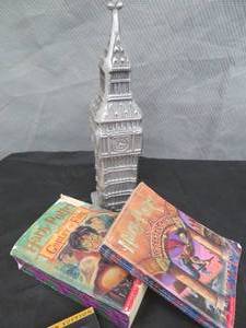lot 107 image: HARRY POTTER LOT. BOOKS, DVDS AND A METAL CLOCK TOWER