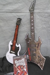 lot 108 image: GUITAR HERO PLAYSTATION 2  LEGENDS OF ROCK AND 2 GUITARS.