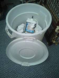 Brute 10 Gallon Garbage Can and Driveway Repair Chemical.
