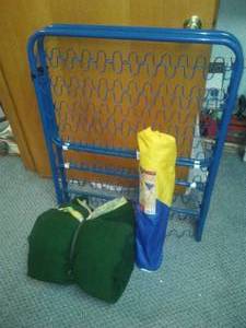 Camping Cot Frame, Sleeping Bag and Camp Table.