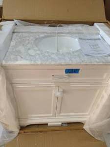 lot 138 image: HOME DECORATORS COLLECTION Windlowe 37 in. W x 22 in. D x 35 in. H Bath Vanity in White with Carrera Marble Vanity Top in White with White Sink