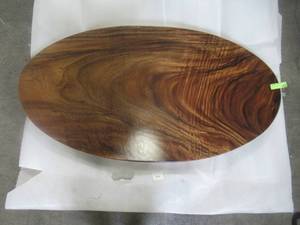 lot 74 image: Solid Wood Handmade Walnut Oval Coffee Table (52281964A) Approximate Dimensions 48 in. x 25 in. x 2.25 in.