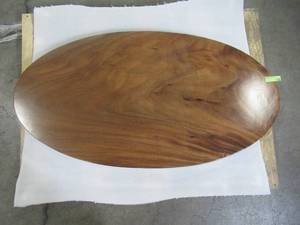 lot 75 image: Solid Wood Handmade Walnut Oval Coffee Table (52281964A) Approximate Dimensions 48 in. x 25 in. x 2.25 in.
