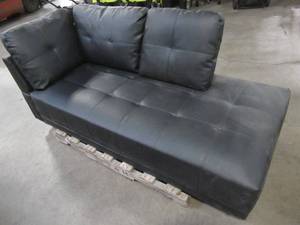 lot 107 image: Faux Leather Chaise Lounge Chair in Black. - Needs some cleaning.