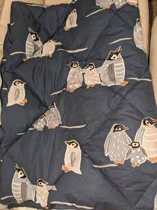 lot 18 image: The Company Store Navy Cotton Throw Blanket with Penguin Print, New