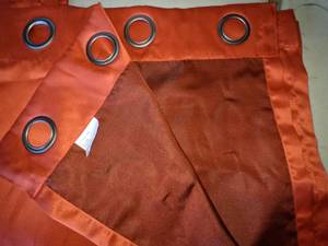 lot 135 image: Pair of Deep Orange Grommet Curtain Panels, 40 x 84
