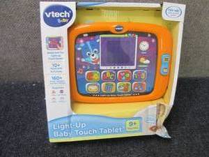 lot 254 image: V-Tech Light-Up Baby Touch Tablet...