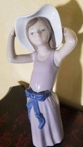 lot 44 image: Lladro Daisa Figurine  Coy Girl with Hat    5011