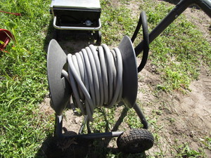 lot 184 image: Garden Hose & Caddy