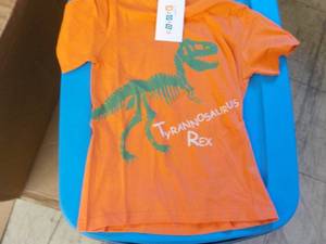 lot 163 image: Coyote and Co. orange Dinasaur T Shirts