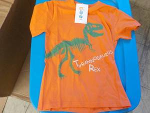lot 164 image: Coyote and Co. orange Dinasaur T Shirts