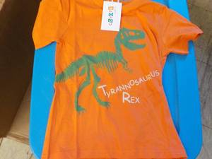 lot 165 image: Coyote and Co. orange Dinasaur T Shirts