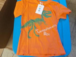 lot 166 image: Coyote and Co. orange Dinasaur T Shirts