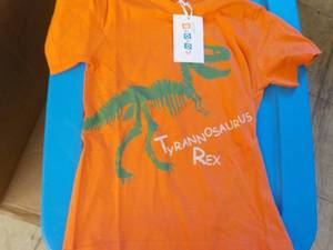 lot 168 image: Coyote and Co. orange Dinasaur T Shirts