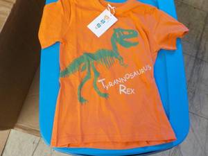 lot 169 image: Coyote and Co. orange Dinasaur T Shirts