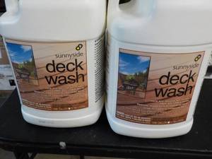 lot 196 image: 2 gallon jugs Sunnyside deck wash...