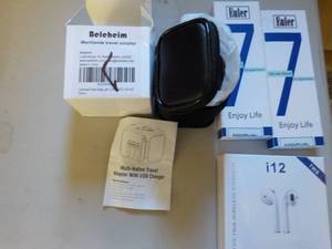 lot 264 image: Travel adapter, ear buds, and Euler...