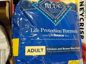 lot 301 image: Blue 38 lb. bag adult dog food...