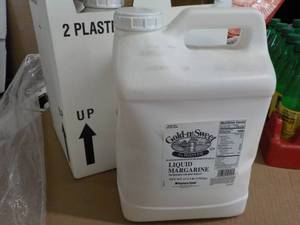 lot 391 image: 2 17.5 lb. jugs Gold-N-Sweet liquid...