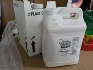 lot 393 image: 2 17.5 lb. jugs Gold-N-Sweet liquid...
