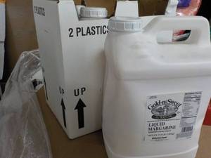 lot 394 image: 2 17.5 lb. jugs Gold-N-Sweet liquid...