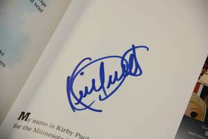 lot 43 image: Minnesota Twins Kirby Puckett Autographed Book  JSA COA