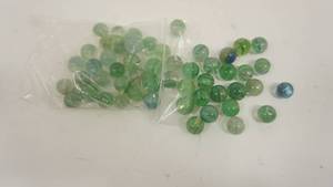 lot 13 image: Zip Lock Bag Filled With Green Marbles