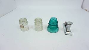 lot 76 image: Two Clear Insulators---One Green Insuator--Vintage Stapler