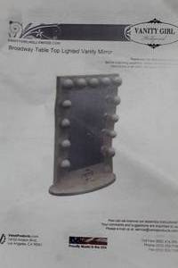 lot 52 image: Vanity Girl Hollywood Broadway Table Top Lighted Vanity Mirror 13-lamp with Power Outlet (in box)